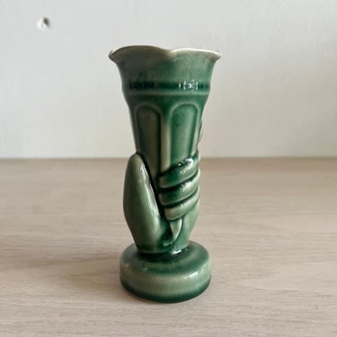 Hand Holding Vase