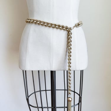 Vintage 1980s Gold Tone Metal Chain Belt with a ball & tassel / up to 34