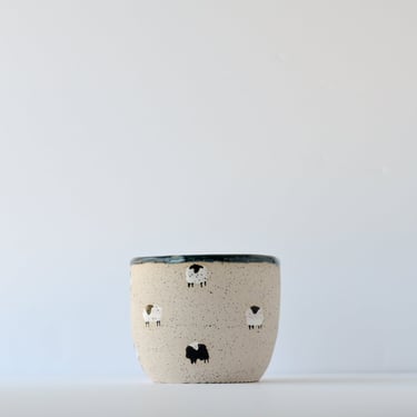 Cup with Two Black Sheep 
