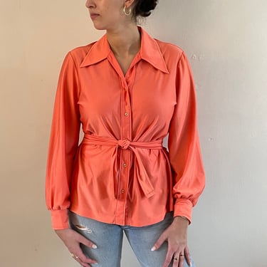 70s belted disco blouse / vintage tangerine orange disco stretch knit jersey pointy collar long sleeve self belted tie blouse | Large 