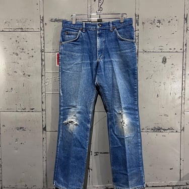 Distressed Size 29x27 80s Lee riders medium wash denim blue Jeans. 