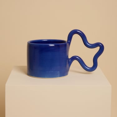 Blue handmade ceramic mug with wiggle handle 