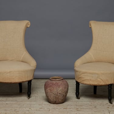 Pair of French Scrolled Back Upholstered Chairs with Turned Ebonized Legs on Casters