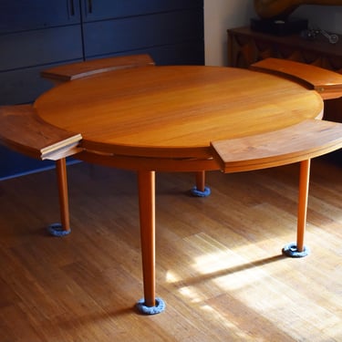 Restored Dyrlund “Flip-Flap” Lotus round expandable Danish teak dining table, circa 1960s 