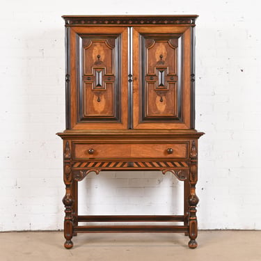 Antique Berkey & Gay English Jacobean Ornate Carved Walnut and Burl Wood Bookcase or Bar Cabinet, Circa 1920s
