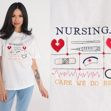 Vintage Nurse Shirt 90s Nursing T-Shirt Care We Do Best Embroidered Graphic Tee RN TShirt Doctor Caretaker Heart Retro White 1990s Medium M 