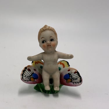 vintage bisque kewpie riding a butterfly made in occupied japan 