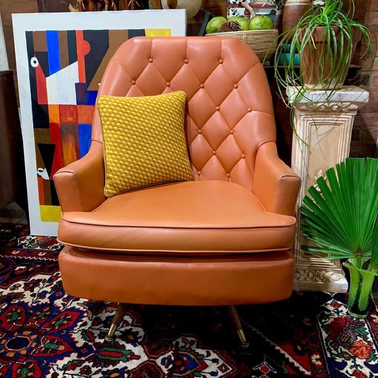 Orange vinyl swivel chair
