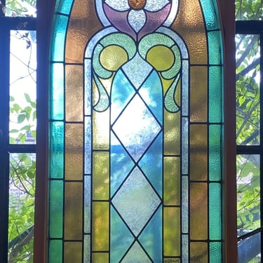 Tall Arched Multicolored Framed Stained Glass