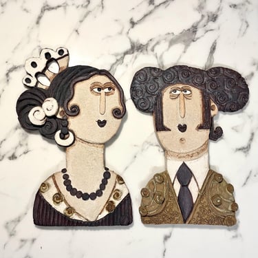 Pair of Ceramic wall relief figures depicting a Toreador (bullfighter) and a Spanish lady 