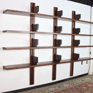 Custom 11 foot wide walnut Pierre Chapo bibliotheque style wall mounted bookcase 