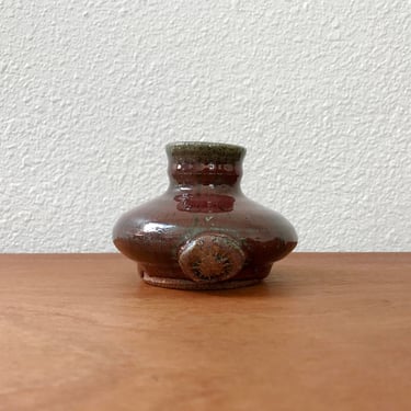 Vintage studio pottery bud vase / deep red handmade pot with sunburst mark 
