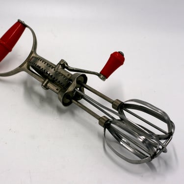 vintage superwhirl egg beater with red handles 