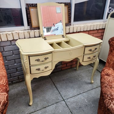 French Provincial Tilt Top Vanity. Two double drawers, beveled tip up mirror, partitioned middle storage section. 45x20x30