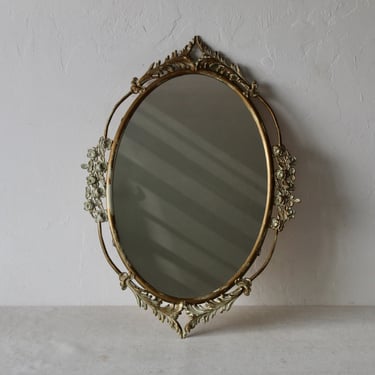 Distressed Tony Duquette Style Gold Brass Finish Oval Wall Accent Mirror Filigree and Flower Detail 