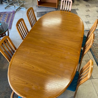 Danish Teak Oval Extendable Dining Table with One Leaf &amp; (8) Eight Dining Chairs by Ansager Mobelfabrik 