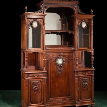 Late 19th Century Monumental French Carved Walnut Cabinet with Wedgwood Plaques