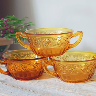 Vintage amber glass soup bowls / Indiana Glass daisy pattern #920 / three vintage amber pressed floral glass berry bowls / two handle bowl 