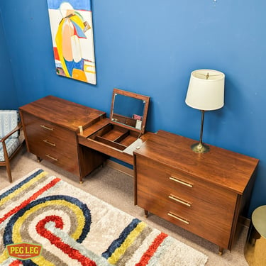Mid-Century Modern walnut bedroom set with two bachelor's chests and a vanity by John Stuart