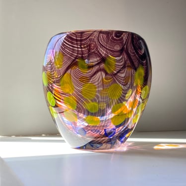 Heavy murano vase with swirl design and dots in yellow, blue and burgundy over clear glass 