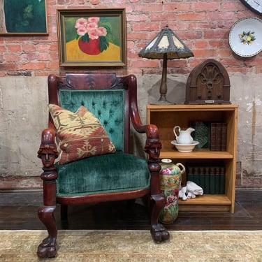 Tufted Victorian green velvet accent chair with small oak bookcase