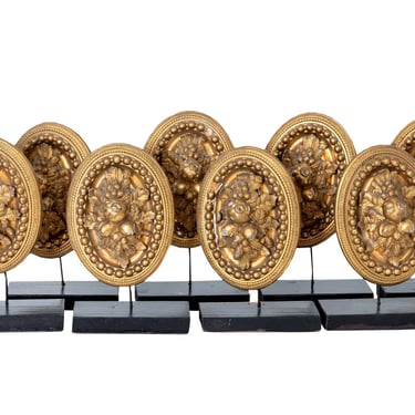 Set of Eight Gilt Empire Tie Backs on Stands