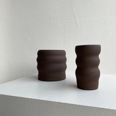 set of dark brown soft line handmade pottery vases. 