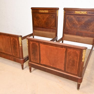 Antique French Regency Louis XVI Inlaid Flame Mahogany Bronze Mounted Twin Size Beds, Pair