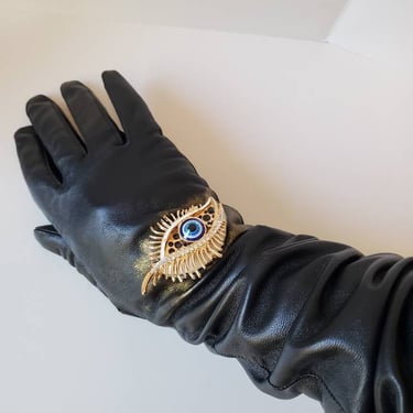 Black leather gloves with custom gold deco eye  hand painted by Amanda Alarcon-Hunter for Minx and Onyx 
