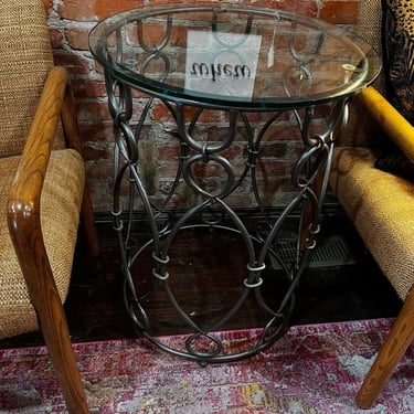 Round glass top side table. 22” x 29” 