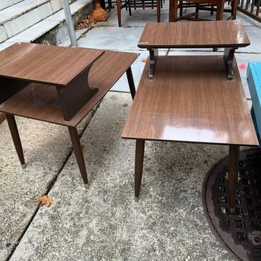 Mid century laminate step top side tables. Perfect for the living or bedroom! One available. 18” x 28” x 22” surfaces are 15” and 22”