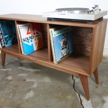 The "Dabble" is a mid century modern record console, record storage. Ready to ship 
