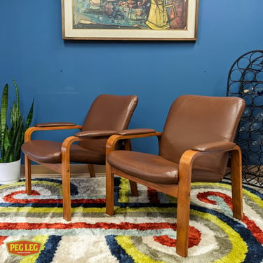 Pair of Danish Modern teak lounge chairs with leather upholstery by Ekornes