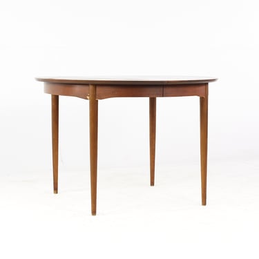 Mainline by Hooker Mid Century Round Walnut Expanding Dining Table with 2 Leaves - mcm 