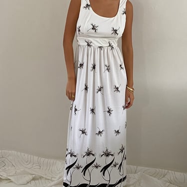 70s maxi dress / vintage white polyester jersey babydoll empire border print sleeveless maxi hostess dress | M 