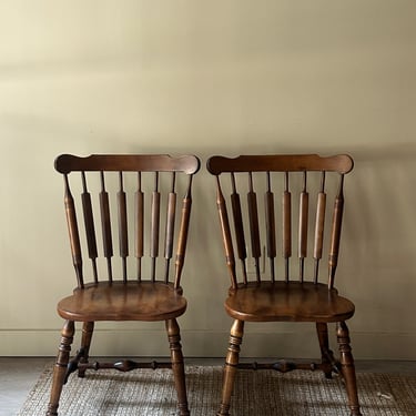 Windsor walnut chairs. Sold in pair.