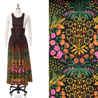 Vintage 1970s Maxi Dress | 70s Floral Border Print Black Bib Fit and Flare Full Length Overdress (small/medium) 