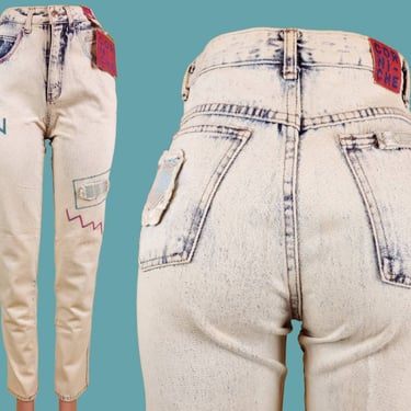 1980s vintage deadstock jeans. Patchwork embroidered distressed frayed stone wash pastels. Iconic new wave. High rise tapered legs.(27 x 30) 