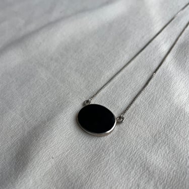 N049 silver and black oval pendant