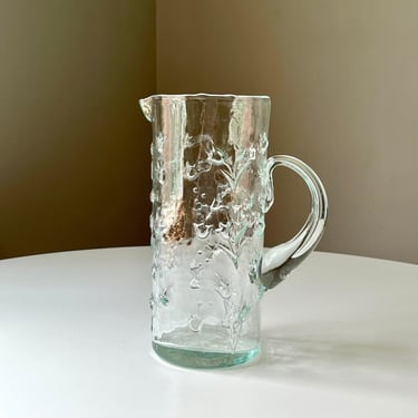 Pale Green Mold Blown Glass Pitcher with an Intricate Embossed Flower Pattern 