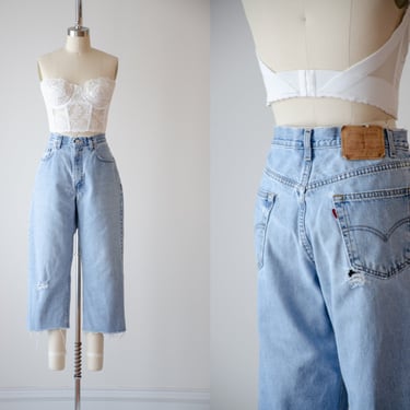 baggy jeans | 90s vintage Levi's 550 distressed frayed relaxed fit men's women's straight leg cropped jeans 
