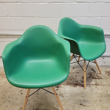 A Pair of Eames Molded Shell Eifel Arm Chairs