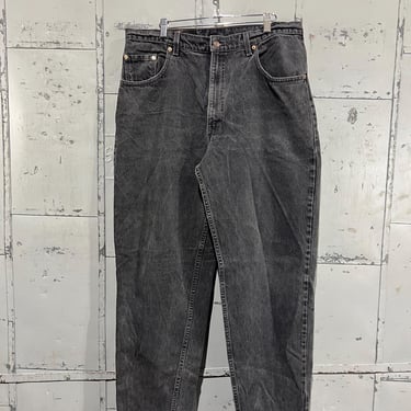 90s Levi’s redtab Tab 560 Tapered Leg High-Waisted Denim Black Jeans distressed faded well worn 