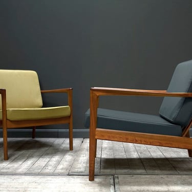 SOLD. A pair of USA 75 Armchairs by Folke Ohlsson for Dux, 1950s (reupholstered to specification). 