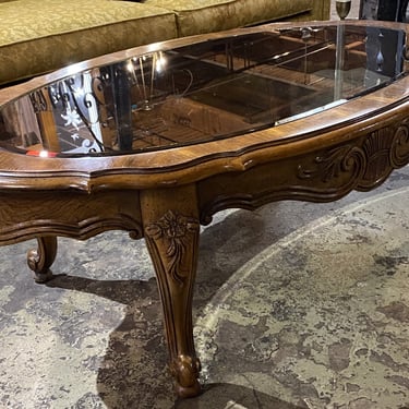 Burled Oval Coffee Table w Carvings and Smoke Glass
