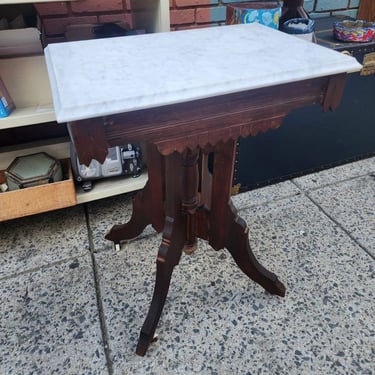On original ceramic casters, carved walnut base, removable marble Top, circa 1890. 24x16x29