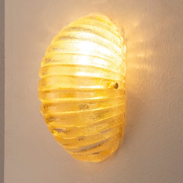 Murano glass shell wall sconce in amber colour with brass structure, Made in Italy wall lamp 