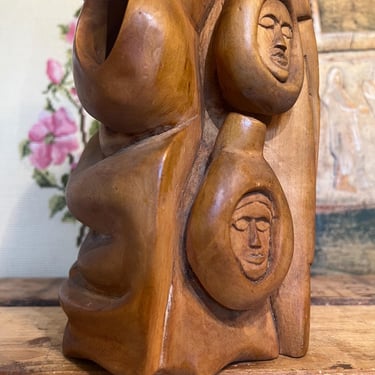 Free Shipping Within Continental US - Vintage handmade abstract wood sculpture in mid century modern style with faces depicted. 