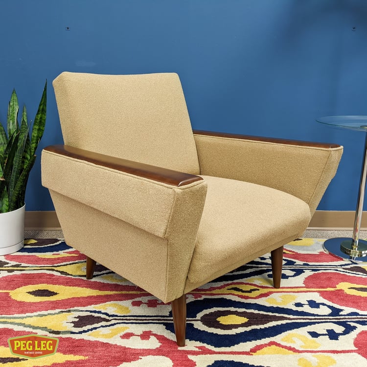 Danish Modern lounge chair with walnut armrests and legs Peg Leg