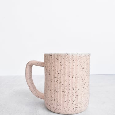 Fluted Ceramic Mug in speckled clay in light pink 